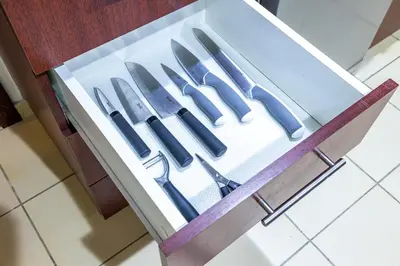 a drawer full of knives in a kitchen cabinet at Family & Group Paradise - JBR Beach 3 min walk - Ain Dubai Views - Heart of JBR - 14 People in Dubai