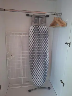 a shower in a bathroom with a glass door at Bright Studio Unit at Lake Terrace with lake view in Dubai