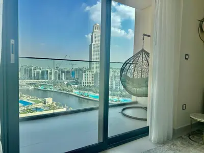 a balcony with a view of a city skyline at NEW Exceptional Lagoon View - 2 Stylish Bedrooms in Dubai