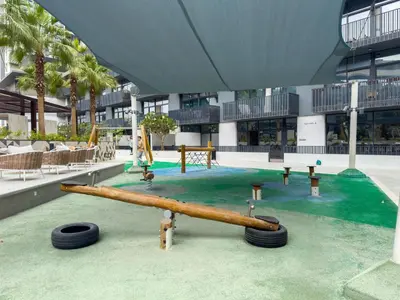 a playground in a building with a slide at Ahlan HH - Beautiful 1BR Home with Pool View - Belgravia III, JVC in Dubai