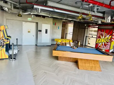 a room with a ping pong table in it at Sunny 1 Bedroom Apartment in Dubai Hills Estate in Dubai