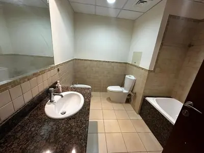 a bathroom with a sink and a toilet at HOT MASTER BED ROOM - JBR WALK Marina in Dubai