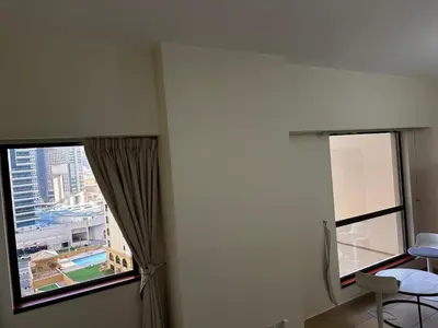 a room with two windows with a view of a city at HOT MASTER BED ROOM - JBR WALK Marina in Dubai