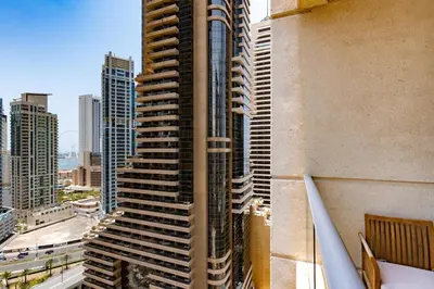 a view of a tall building in a city at Vacay Lettings - 1 BHK - Iris Blue Dubai Marina in Dubai