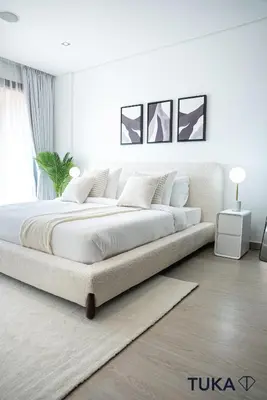 a white bedroom with a large bed in a room at Private Beach - 1-BHK - Palm Jumeirah - Resort in Dubai