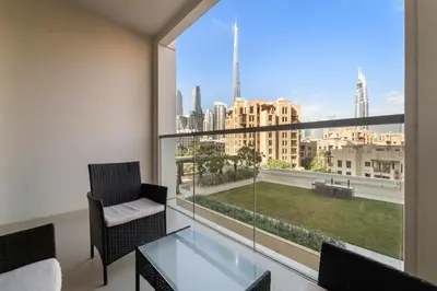 a room with a large window with a view of the city at 2BR plus Maid Bellevue Tower 1, Burj Khalifa View in Dubai