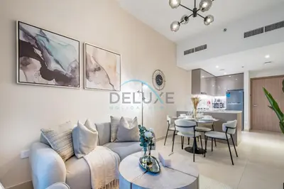 a living room with a couch and a table at Contemporary 2BR in Azizi Park Avenue, Nad Al Sheba by Deluxe Holiday Homes in Dubai