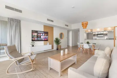 a living room with a couch and a table at Superb Marina Views I Sleeps 5 in Dubai