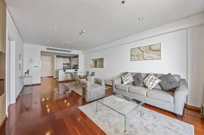a living room with a couch and a table at Burj View Luxury 1BR - Full Sea View Private Beach - Anantara Palm in Dubai