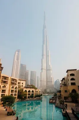 a view of the burj khalifa and a river with buildings at 1001 Nights - Luxury 1-BR apartment near Burj in Dubai