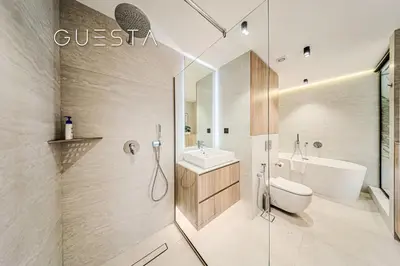 a bathroom with a shower and a toilet and a sink at Jumeirah Beach Residence - Rimal 6, Dubai Marina in Dubai