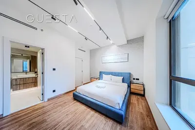 a bedroom with a bed and a large window at Jumeirah Beach Residence - Rimal 6, Dubai Marina in Dubai