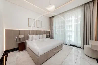 a bedroom with a white bed and a large window at Luxury 2Bdr Apartment in Business Bay in Dubai