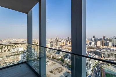 a view of a city from an office building at Superhost - Bright & Stylish 1-Bedroom in Bloom Tower, JVC in Dubai