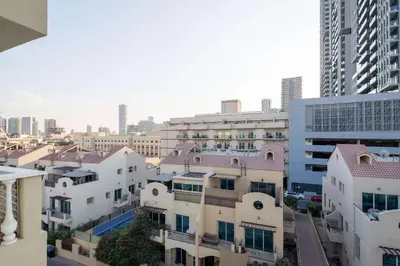 an aerial view of a city with buildings at Frank Porter - Hanover Square in Dubai