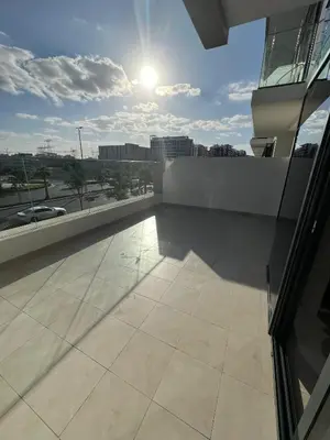 a balcony of a building with a view of a street at Special Offer Rental One Bedroom Apartment at Azizi Riviera Dubai in Dubai