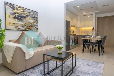 a living room with a couch and a table at Bloomfields Stylish 1br In Azizi Riviera in Dubai