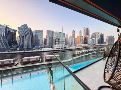 a view of the city from the top of a building at Sunset View Overlooking Burj Khalifa and Canal View in Dubai
