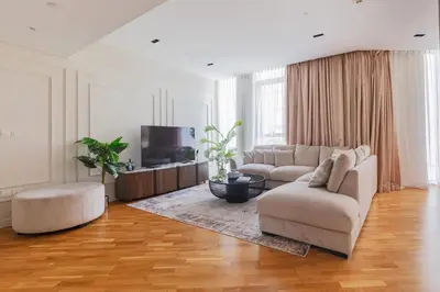 a living room with a couch and a tv at 2BDR Apartment in Bluewaters Luxury Area in Dubai