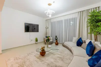 a living room with a couch and a table at 3 Bedrooms Apartment in Downtown Views - Dubai Burj Khalifa View in Dubai
