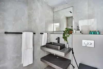 a bathroom with a sink and a mirror at Frank Porter - Marina Quays East Tower in Dubai