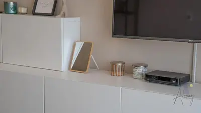 a white counter with a tv and a radio at Cityview Haven 1BR Modern Flat in Bloom Heights in Dubai
