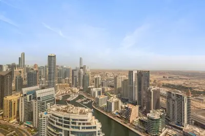 an aerial view of a city with tall buildings at Exceptional high floor 3bed apartment by Suiteable in Dubai