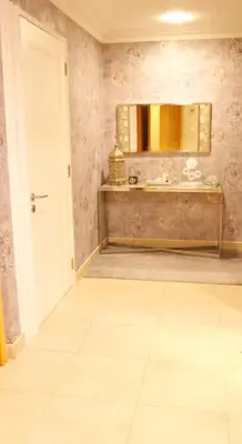 a bathroom with a sink and a mirror at Royal Classic by oima leasing property in Dubai