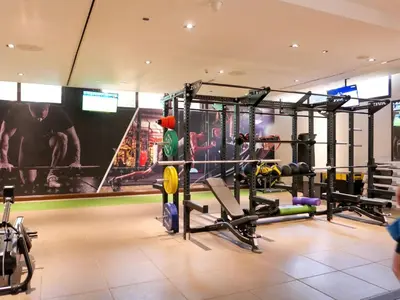 a gym with several equipment in a room at Waterfront 2BR Apartment with Sea Views in Dubai