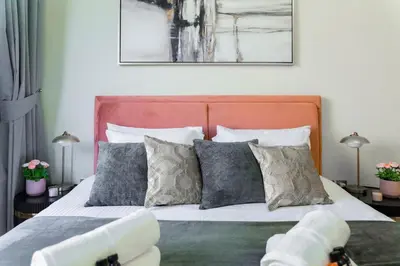 a bedroom with a large bed with pillows at Studio next Dubai Mall with pool in Dubai