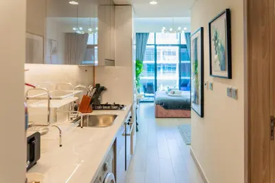 a kitchen with a sink and a counter top at Studio next Dubai Mall with pool in Dubai