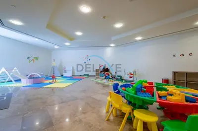 a play room with a bunch of play equipment at Elegant 2BR in Sky Gardens DIFC by Deluxe Holiday Homes in Dubai