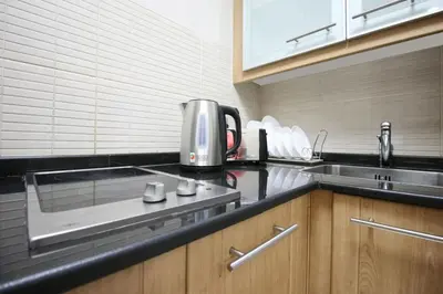 a kitchen with a coffee maker on the counter at Studio in Dubai Marina by beach & Metro - Z313 in Dubai