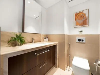 a bathroom with a sink and a toilet at Kensington Stylish 1BR at The Lofts East Downtown in Dubai