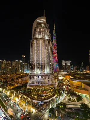 a large building with a lot of traffic at night at Kensington Stylish 1BR at The Lofts East Downtown in Dubai
