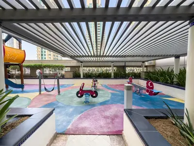 a playground in a building with a large ceiling at Kensington Chic 1BR Fountain-view Flat Downtown Burj Khalifa in Dubai