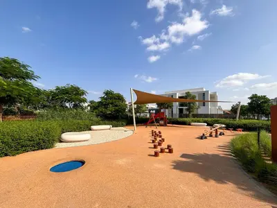 a picnic area with a tent and a playground at Frank Porter - Ranches 3 in Dubai