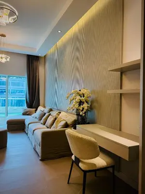 a living room with a couch and a table and chairs at Marina View Tower A in Dubai