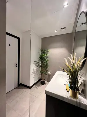 a bathroom with a sink and two potted plants at Gennaro's Home at 15 Northside Business Bay in Dubai