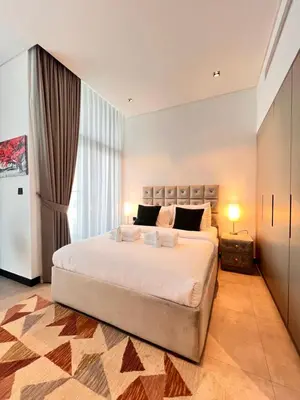 a bedroom with a large bed and a large window at Gennaro's Home at 15 Northside Business Bay in Dubai