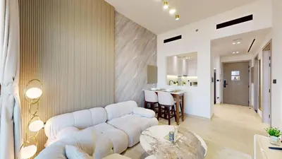 a living room with a couch and a table at Locations I Binghatti Luna - JVC I Modern 1BR Apartment I Upgraded Interiors & Comfortable Stay I Scenic Community & Skyline Views in Dubai