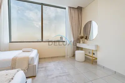 a bedroom with a bed and a mirror at Delightful 2BR at Sky Gardens DIFC by Deluxe Holiday Homes in Dubai