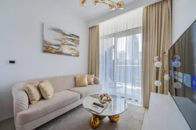 a living room with a couch and a table at Wohnung mit Blick auf den Burj Khalifa im Stadtzentrum von Dubai in Dubai