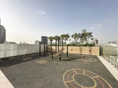 a parking lot with a playground on top of a building at Trophy Luxury Stellar Sky Suites in JVC with Great Views in Dubai