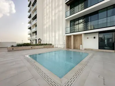 a swimming pool in the middle of a building at Trophy Luxury Stellar Sky Suites in JVC with Great Views in Dubai