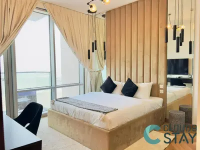 a bedroom with a bed and a large window at Cloud 9 - Luxurious 1 Bedroom Apartment in Business Bay in Dubai