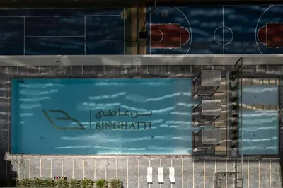 a swimming pool with a sign for a resort at Chic 1 Bed in Creek Side with Terrace in Dubai