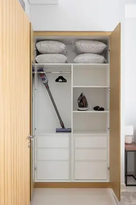 a closet with white drawers in a room at Cozy 2BR in Business Bay, Aykon Tower in Dubai