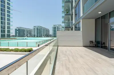 an empty balcony of a building with a pool at Luxury apartment in Dubai center, District One in Dubai