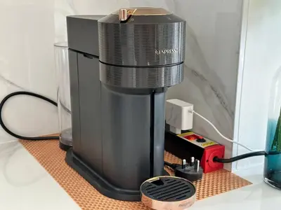 a coffee maker sitting on top of a table at Gorgeous 1br Apt In Jvc in Dubai